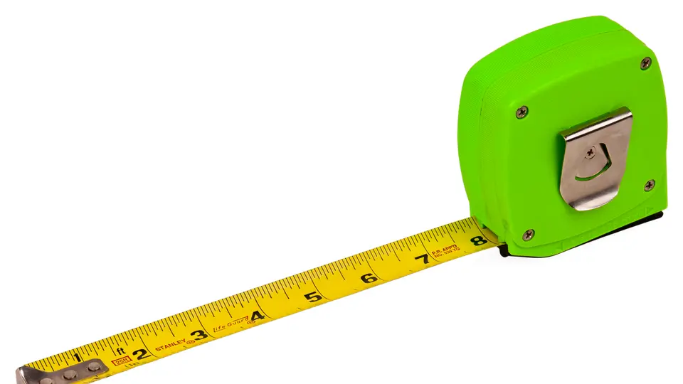 A green tape measure with its yellow tape pulled out